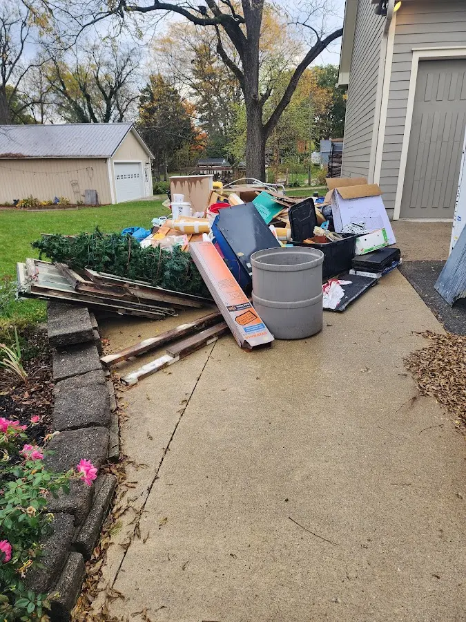 Dumpster being loaded with debris for Estate Cleanout Dumpster Rental in Harding